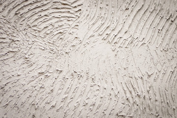 Plastered wall. Plastered wall with traces of rough handling. 