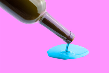 purple liquid pours out of the bottle
