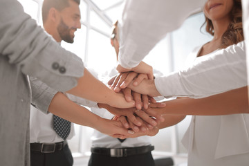 Fototapeta premium close up. business team with hands folded together