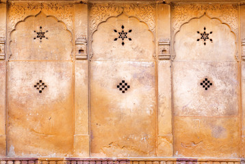 Patterns with stars on wall of historical house in Rajasthan, India.
