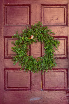 christmas wreath on wooden door