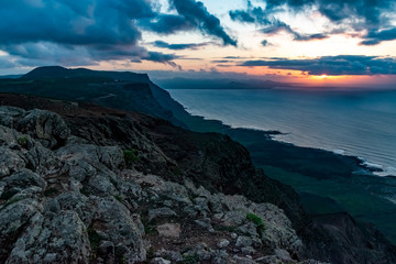 Obraz na płótnie Canvas View at Atlantic ocean and La Graciosa island at sunset from El Mirador del Rio in Lanzarote, Canary Islands, Spain.