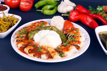 Turkish Beyti Kebap garnished with vegetables