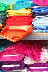 Stack of silky fabrics on market