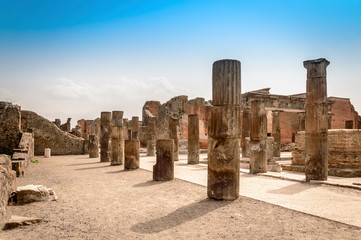 Pompeii ruins: destroyed stone columns at archaeological site