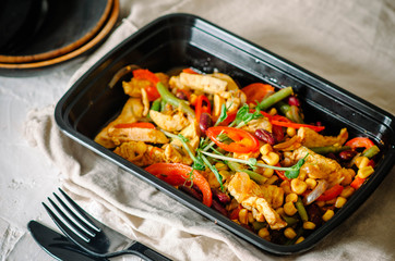 Meat with beans, corn, asparagus beans, sweet peppers, chili peppers and microgreen. Healthy food and diet concept, restaurant dish delivery. Take away of fitness meal. Weight loss nutrition in boxes.