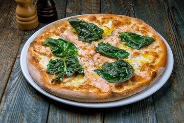 Pizza with salmon and Philadelphia cheese