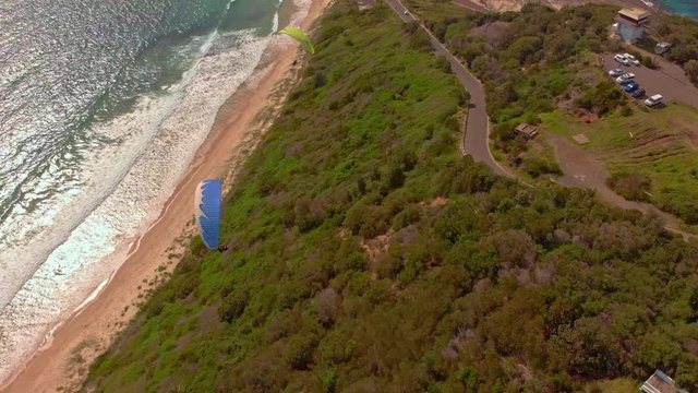 Amazing drone footage of paragliders out at sea