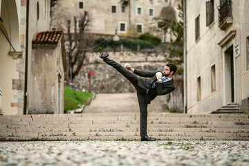 Young businessman doing martial arts