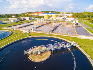 Aerial view to sewage treatment plant. Grey water recycling. Waste management in European Union. - obrazy, fototapety, plakaty