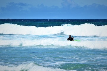 Surfer on the beach.Phillip Island.Victoria.Australia