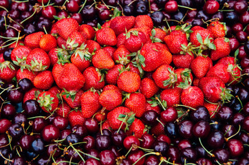 Strawberries and cherries in the market