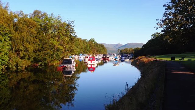 Anchored boats at Balloch, Highland, Scotland, between Loch Lomond and River Leven