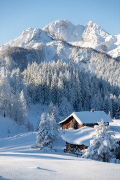  Beautiful winter mountain landscape with snowcapped wooden hut