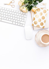Female workspace with computer, roses flowers bouquet, golden accessories, diary, laptop, glasses on white background. Flat lay women's office desk. Top view feminine background.