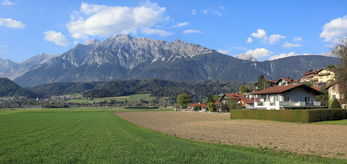 Panoramic view of the market town of Wattens against the Karwendel mountains. Wattens, Innsbruck-Land district, state of Tyrol, Austria. © balakate