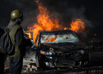 Riots, street fire, car burn