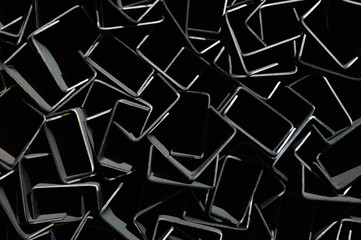 Abstract geometric background. Metal rectangles on a dark background.