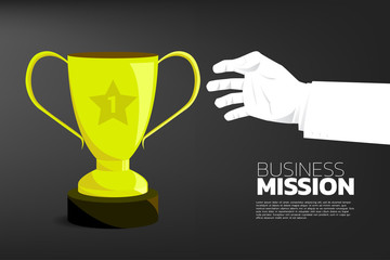 Businessman Hand reach to grab Gold trophy cup award. background concept for try to win and complete mission