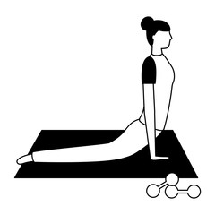 woman making yoga with mat and dumbbells