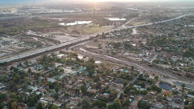 Drone getting aerial footage of the 210 freeway at Wheatland in lake view terrace, California and the surrounding area.