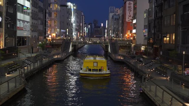 Boat going by in the Dotonbori area in Osaka, Japan