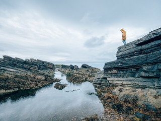 a man exploring the coast of scotland