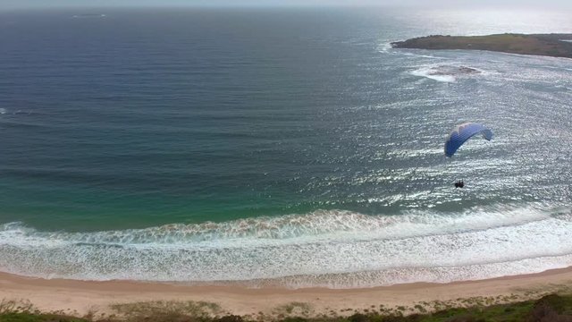 Amazing drone footage of paragliders out at sea