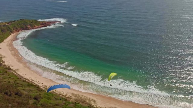 Amazing drone footage of paragliders out at sea