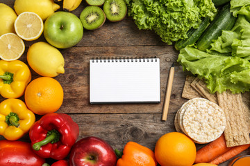 Flat lay composition with healthy food and space for text on wooden background. Concept of weight...