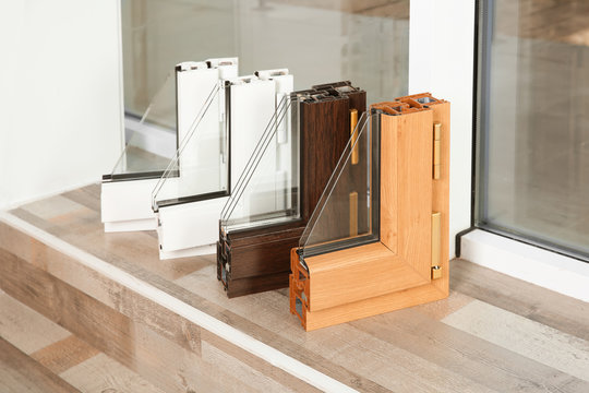 Samples of modern window profiles on sill indoors. Installation service