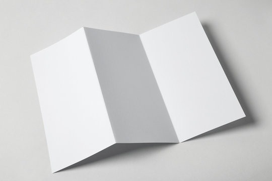 Blank Brochure On White Background, Above View. Mock Up For Design