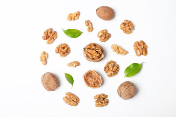Composition with walnuts on white background, top view