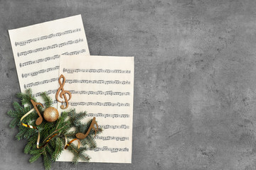 Composition with wooden music notes and space for text on grey background, top view