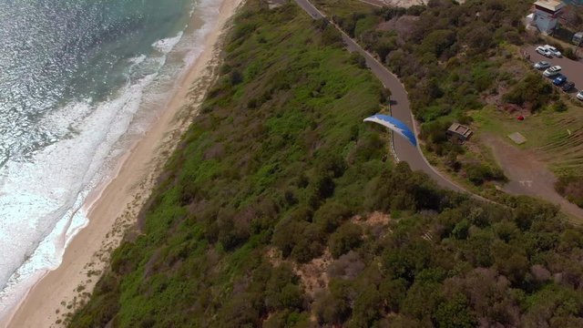 Amazing drone footage of paragliders out at sea