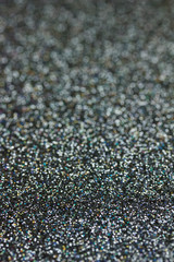 Macro abstract silver and black glitter background with bokeh