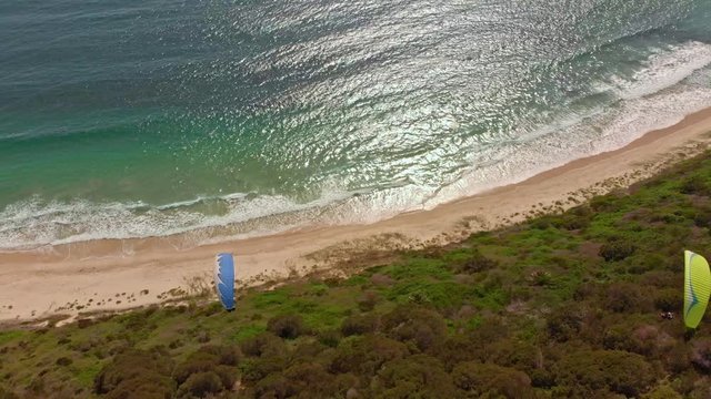 Amazing drone footage of paragliders out at sea