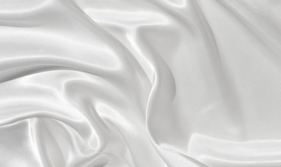 The texture of the satin fabric of white color for the background