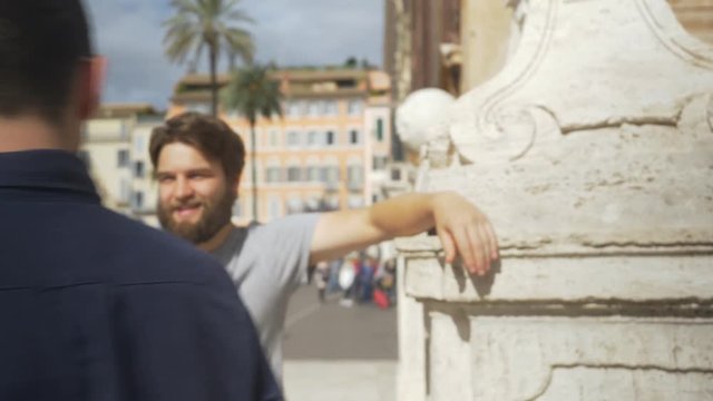 Trendy Young Men Talking In City Environment.
