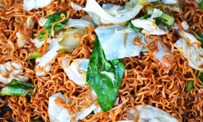 Stir fried instant noodles with Vegetable Thai food / Pad Thai rice noodles stir fried in street food.