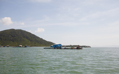 Floating fisherman house on the sea in Vietnam