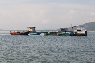 Fototapeta na wymiar Floating fisherman house on the sea in Vietnam