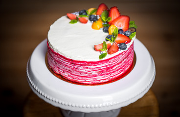 Delicious raspberry cake with fresh strawberries