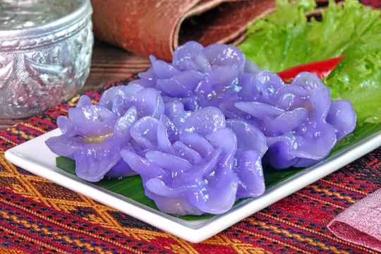 Dumpling : Purple blue color Flower-shaped Thai dumpling (Khanom Chor Muang) Famous ancient Thai appetizers.(Purple / Blue color from the Asian pigionwings flower (Butterfly / Darwin pea))
