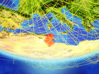 Tunisia on model of planet Earth with network representing travel and communication.