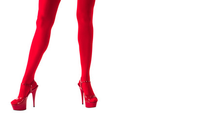 Sexy female legs in fetish red stockings and red high heels, isolated on white, dance and show.