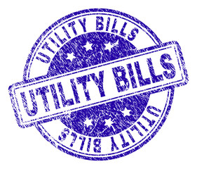 UTILITY BILLS stamp seal imprint with distress texture. Designed with rounded rectangles and circles. Blue vector rubber print of UTILITY BILLS label with grunge texture.