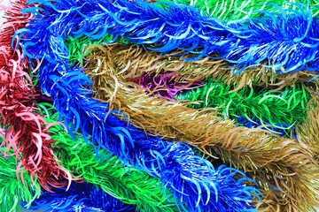 Multi colors bunch fur or Christmas tree tinsel garland. Christmas and New year celebration.