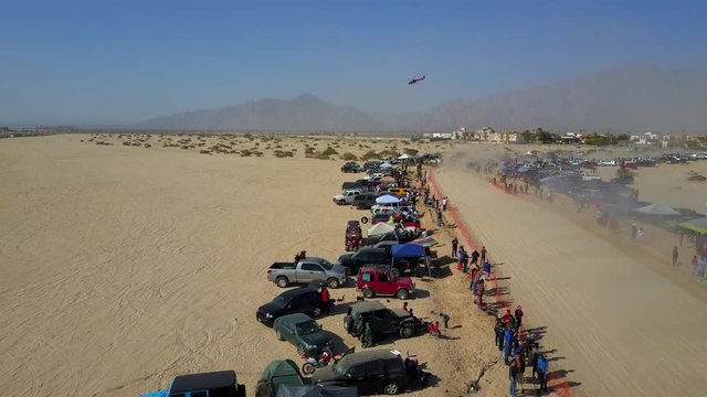 Aerial shot of the San Felipe 250 race. Crowd on both sides of the track enjoying the race.