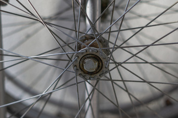 Old and rusty bicycle spokes wheel